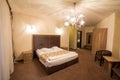 Twin hotel room, modern classical design, with a double bed, with warm colors, being ready for a business customer