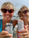 Twin Lakes, WI/USA - 09-11-2019: Happy women taking selfie with drinks on a boat