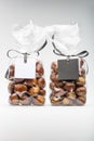 Twin luxury plastic bags of fresh chestnuts with blank labels Royalty Free Stock Photo