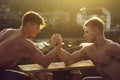 Twin men bodybuilders arm wrestling