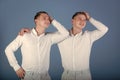 Twin models. Happy men hugging and touching hair Royalty Free Stock Photo