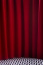 Twin peaks scene with red velvet curtain and black and white tile on floor, vertical. Theatre blank stage for presentation.