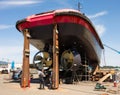 The underside of a big ocean-going tugboat under repairs at a facility in washington