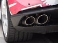 Twin rear exhaust pipes of luxury Lamborghini Italian car. Close up.