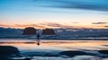 Twin Rocks at Rockaway Beach in Oregon during summer sunset. Young boy with surf by twin rocks on Rockaway beach Royalty Free Stock Photo