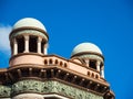 Twin round dome on top of an old building with blue sky in the background. Royalty Free Stock Photo