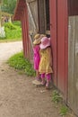 Twin Sisters Looking to See What is in the Barn