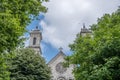 The Twin Spires and Stained-Glass Window of a Secluded Church