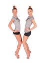 Twin sport girls stands on tiptoe