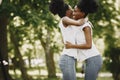 Two afro-american sisters hugging in a park Royalty Free Stock Photo