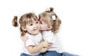 Twin toddlers kissing