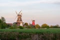 Twin windmills in Greetsiel in spring Royalty Free Stock Photo