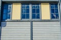 The twin windows on old timber house. Royalty Free Stock Photo