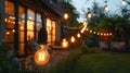 Twinkling Delight: Outdoor String Lights Add Charm to Backyard Garden Party and Camping Decor Royalty Free Stock Photo