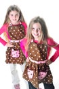 Twins in aprons