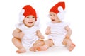 Twins baby playing in hats