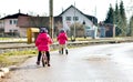 Twins children riding balance bikes on the road with helmet. Royalty Free Stock Photo