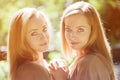 Twins. A group of young beautiful girls. Two women face close-up. Trendy stylish sisters Royalty Free Stock Photo