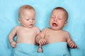 Twins is laughing on the blue