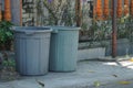 Twins of Plastic Grey Dustbin outside the gate Royalty Free Stock Photo