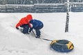 Twins play snowfall time with the inflatable sledge, snow tube