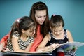 Twins and young educator studying Royalty Free Stock Photo