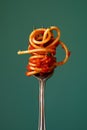 Twirled Pasta on Fork Against Teal Background