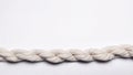Twisted beige cotton rope on white background Royalty Free Stock Photo
