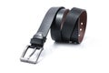 Twisted black male leather belt isolated on a white background.