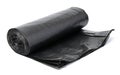 Twisted black polyethylene garbage bags on a white isolated background