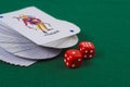 Twisted deck of cards with dice Royalty Free Stock Photo