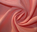 Twisted dull peachy fabric Royalty Free Stock Photo