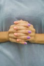 Twisted fingers with a beautiful manicure Royalty Free Stock Photo