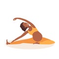 Twisted Head-to-Knee Pose. Pregnant African American woman doing yoga. Woman in sportswear doing floor exercises at home