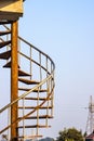 Twisted iron stairs of a watchtower inside of an industrial project