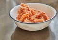 Twisted minced salmon in bowl in the kitchen for making tartare