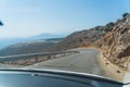 Twisted mountain road to the Seitan limania beach on Crete, Greece, driving while summer holidays