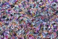 Multi-layer multi-colored background with a chaotic pattern. twisted multicolored lines.