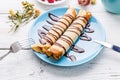 Twisted pancakes stuffed with chocolate