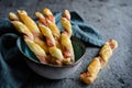 Twisted puff pastry sticks with bacon Royalty Free Stock Photo