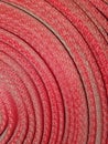 Twisted red fire hose. Royalty Free Stock Photo