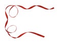 Twisted red satin ribbon in a border arrangement Royalty Free Stock Photo