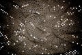 Twisted silver grey sequined fabric background