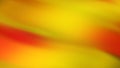 Twisted vibrant iridescent blurred gradient of red yellow orange colors with smooth movement of the gradient in the frame with