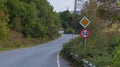 Twisty asphalt road with speed sign Royalty Free Stock Photo