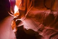 Twisty fiery curves of the Lower Canyon Antelope in Arizona illuminated by the meager rays of light carry tourists to