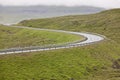 Twisty scenic road with green landscape in Faroe Islands