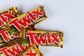 Twix candy bars with caramel and milk chocolate made by Mars, Inc. on white background