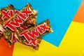 Twix is a chocolate bar made by Mars, Inc., with caramel and milk chocolate A close-up of Twix cookie bars candy bars on orange