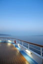 Twlight over a cruise ship deck; a relaxing way to travel, sailing across the calm ocean Royalty Free Stock Photo